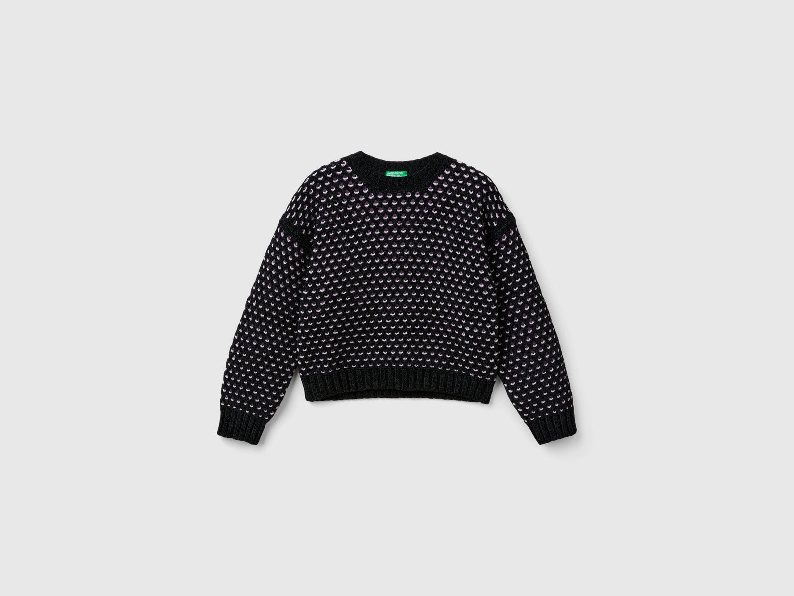 Maglia boxy fit in ciniglia da bambina nero | Benetton Outlet
