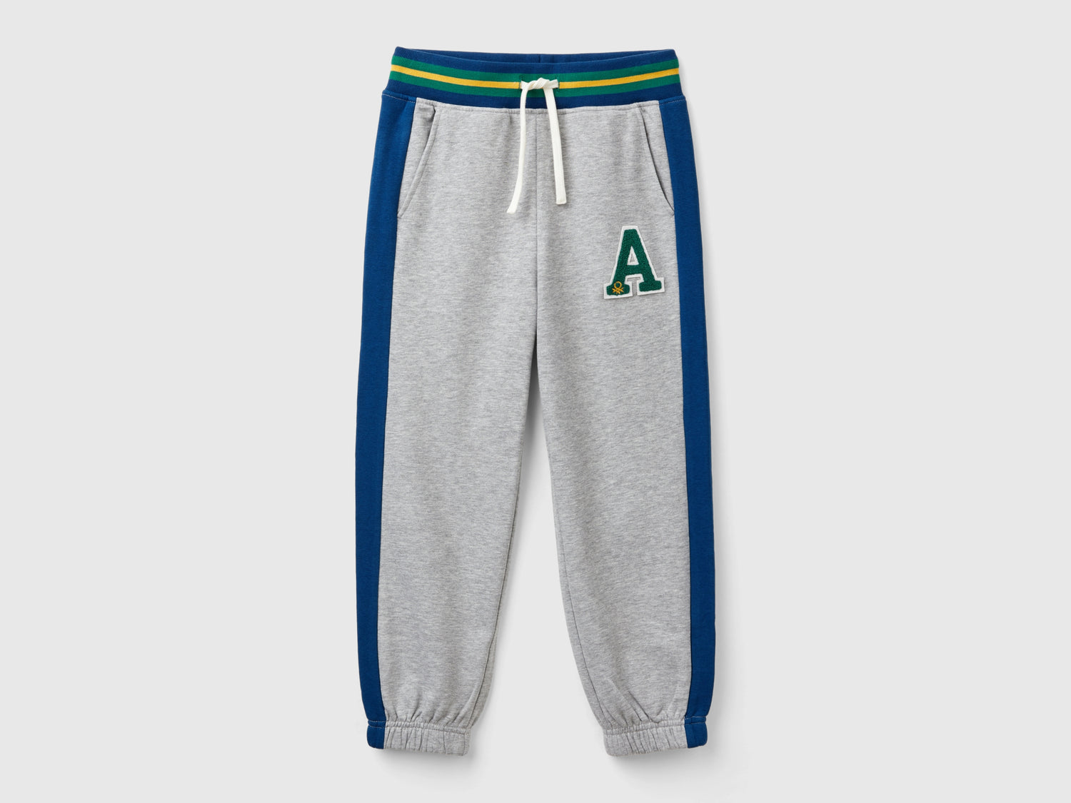 Pantaloni in felpa con bande da bambino grigio chiaro | Benetton Outlet