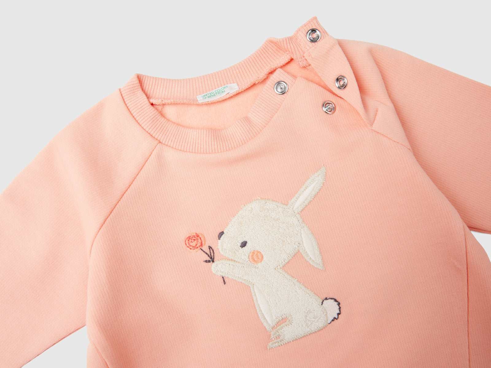 Felpa con ricamo animaletto da neonato pesca 3 | Benetton Outlet