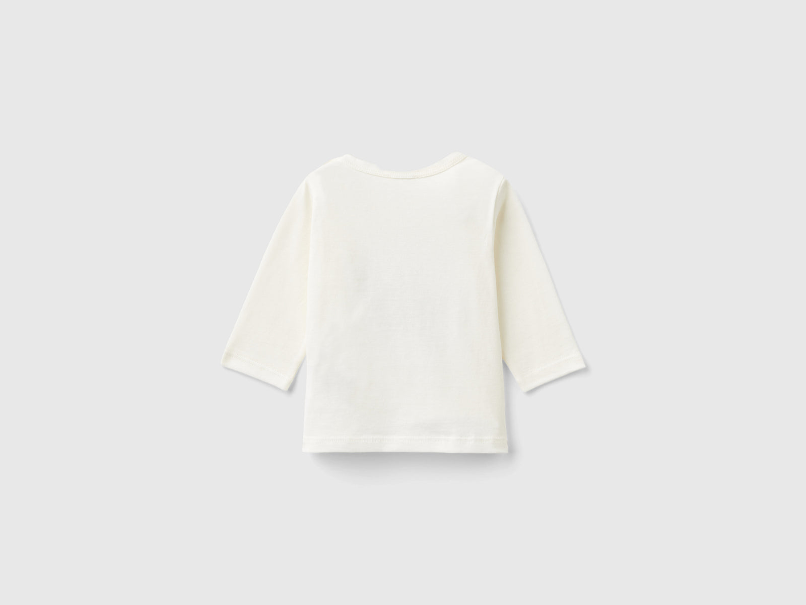 Camiseta con estampado en cálido algodón orgánico. da neonato bianco panna 2 | Benetton Outlet