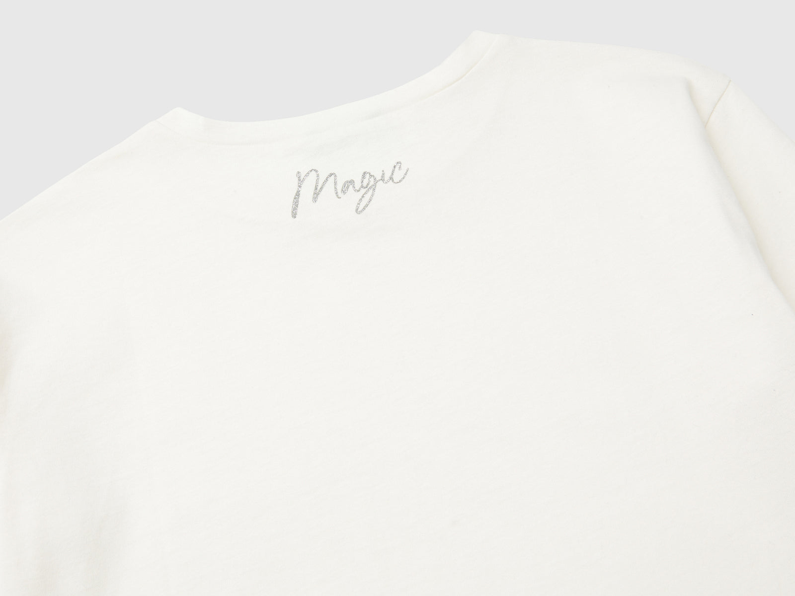 T-shirt con stampa glitter da bambina bianco panna 3 | Benetton Outlet