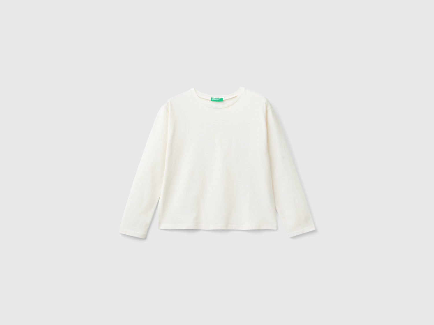 T-shirt con stampa glitter da bambina bianco panna | Benetton Outlet