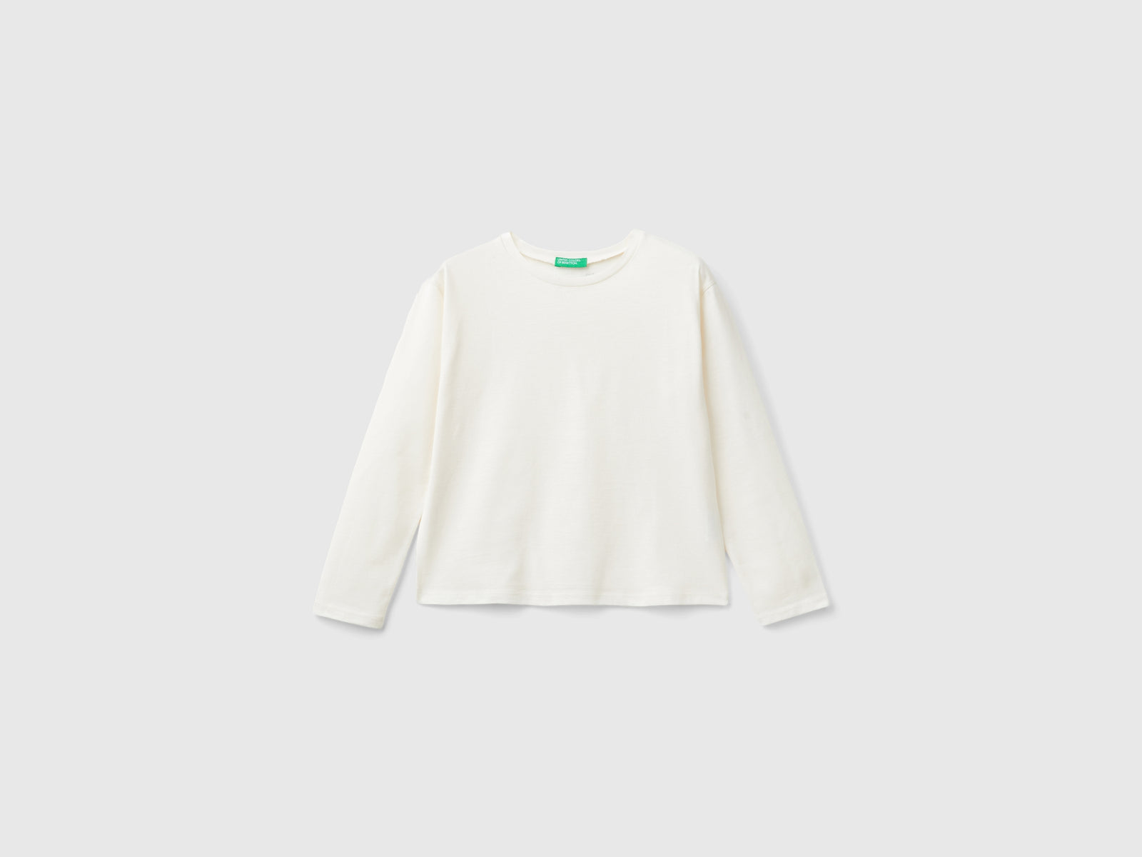 T-shirt con stampa glitter da bambina bianco panna | Benetton Outlet