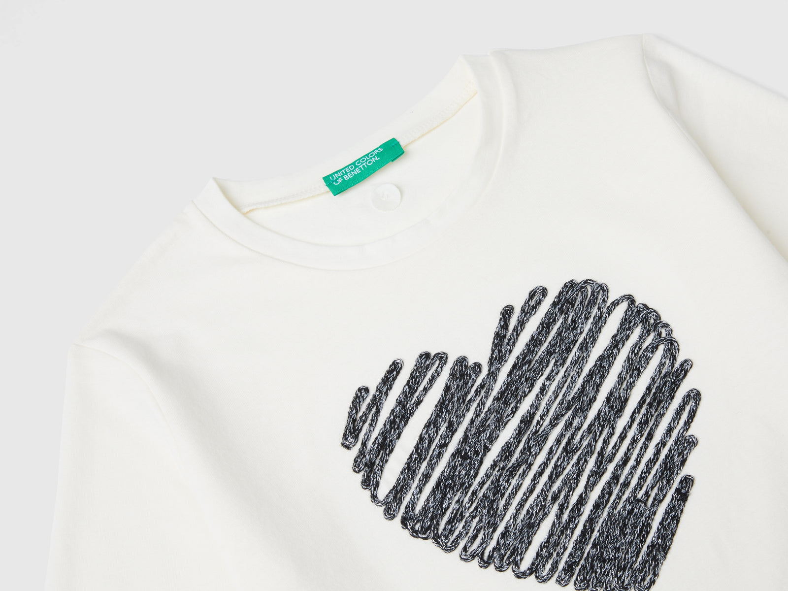 Maglietta con ricamo in lurex da bambina bianco panna 3 | Benetton Outlet