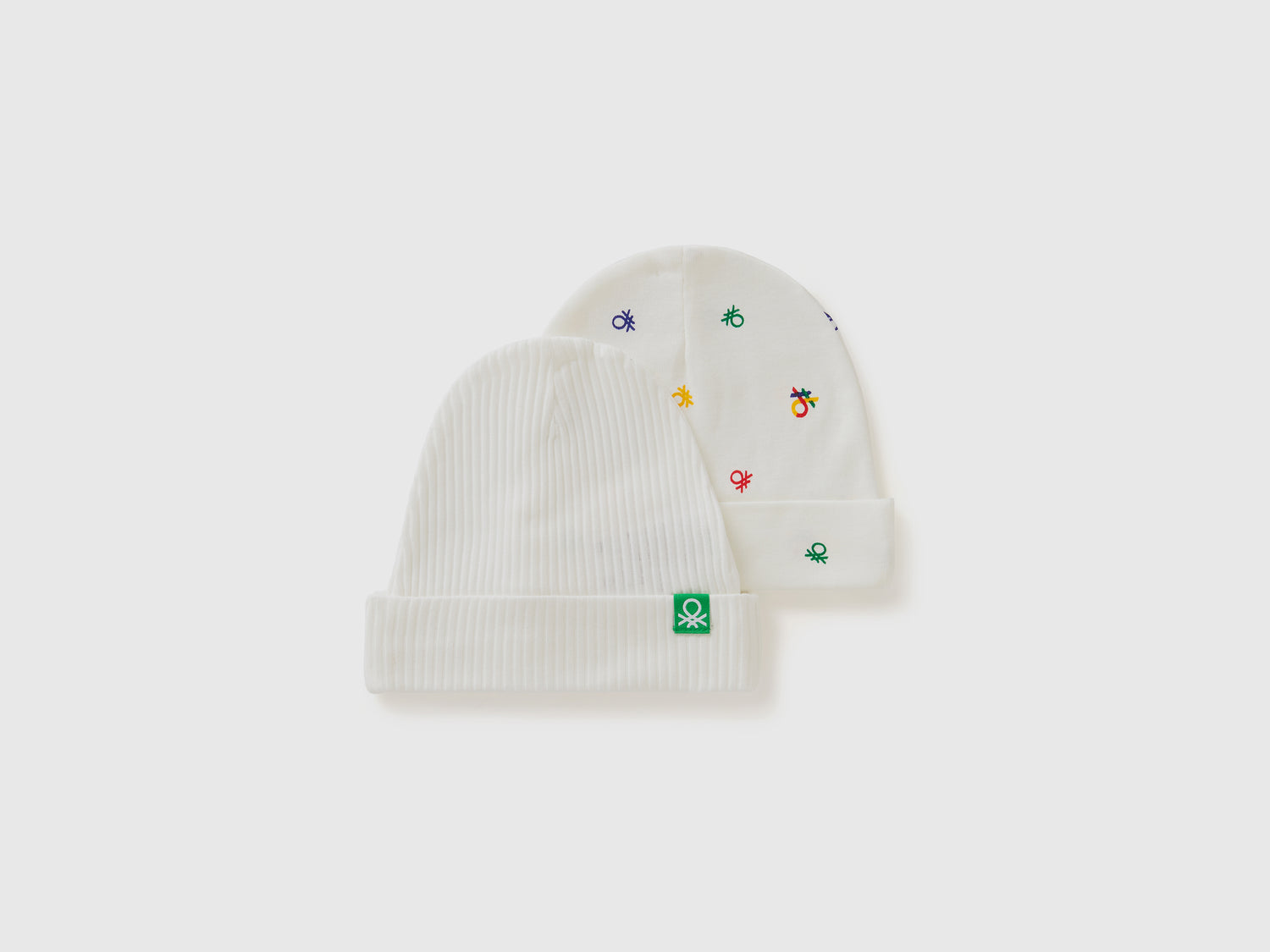 Two organic cotton hats da neonato bianco panna | Benetton Outlet