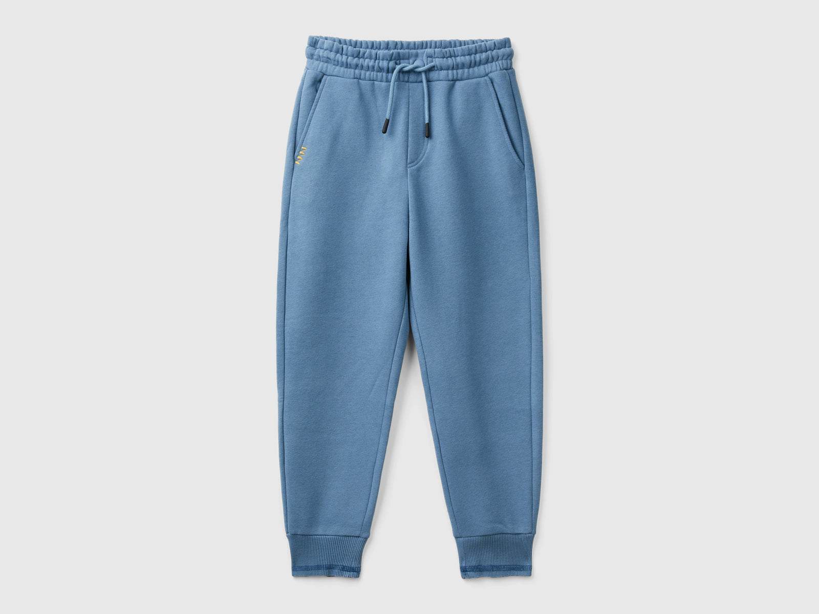 Pantaloni in calda felpa con stampa da bambino avio | Benetton Outlet