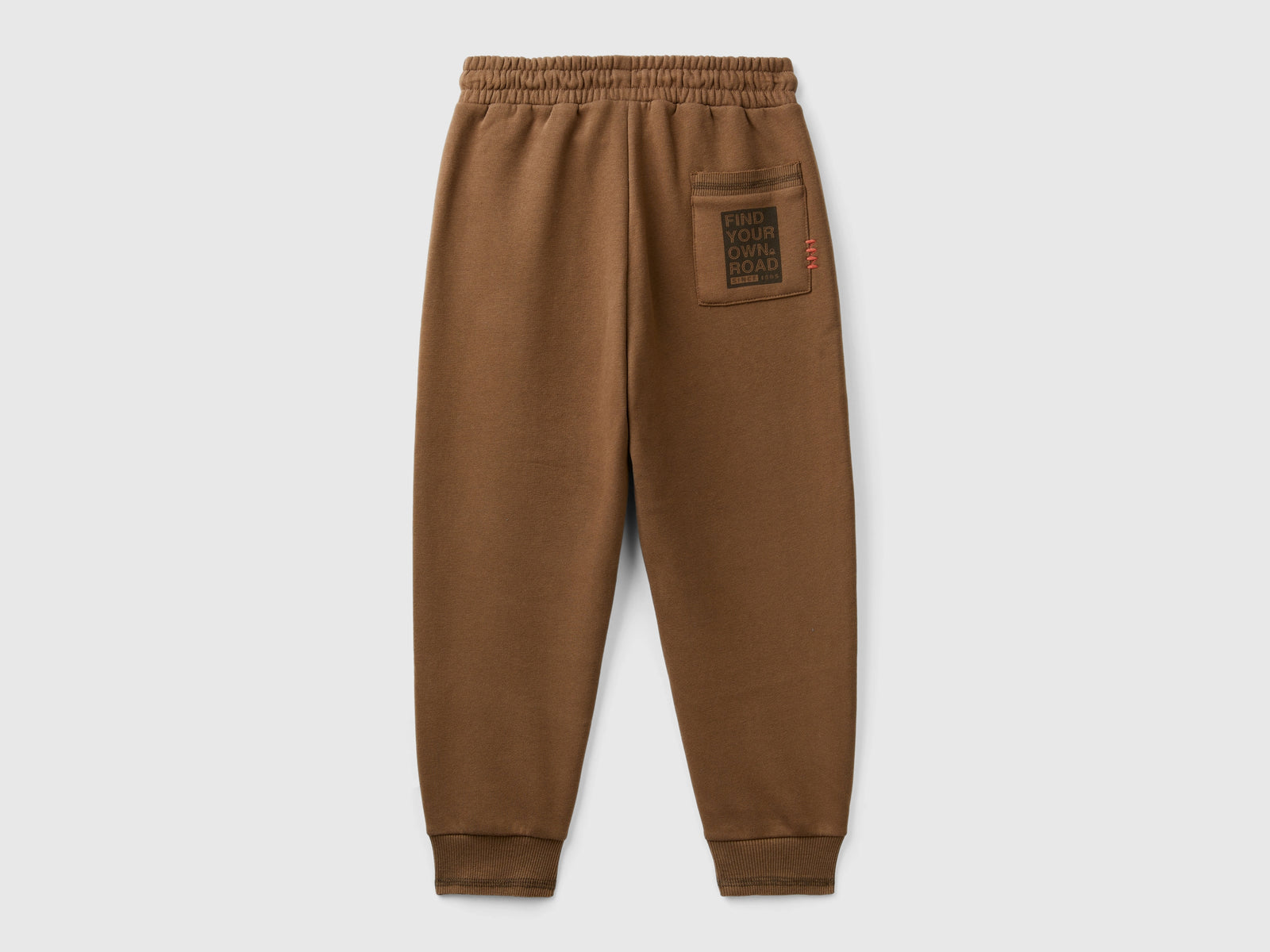 Pantaloni in calda felpa con stampa da bambino marrone 2 | Benetton Outlet