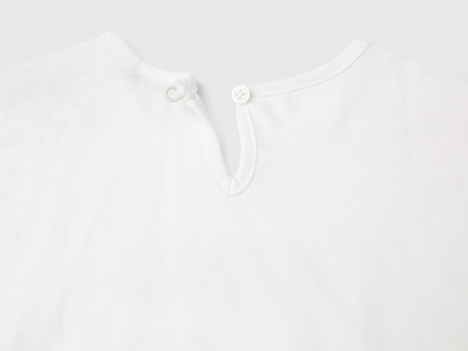 Maglietta con stampa glitter da bimba bianco panna 3 | Benetton Outlet