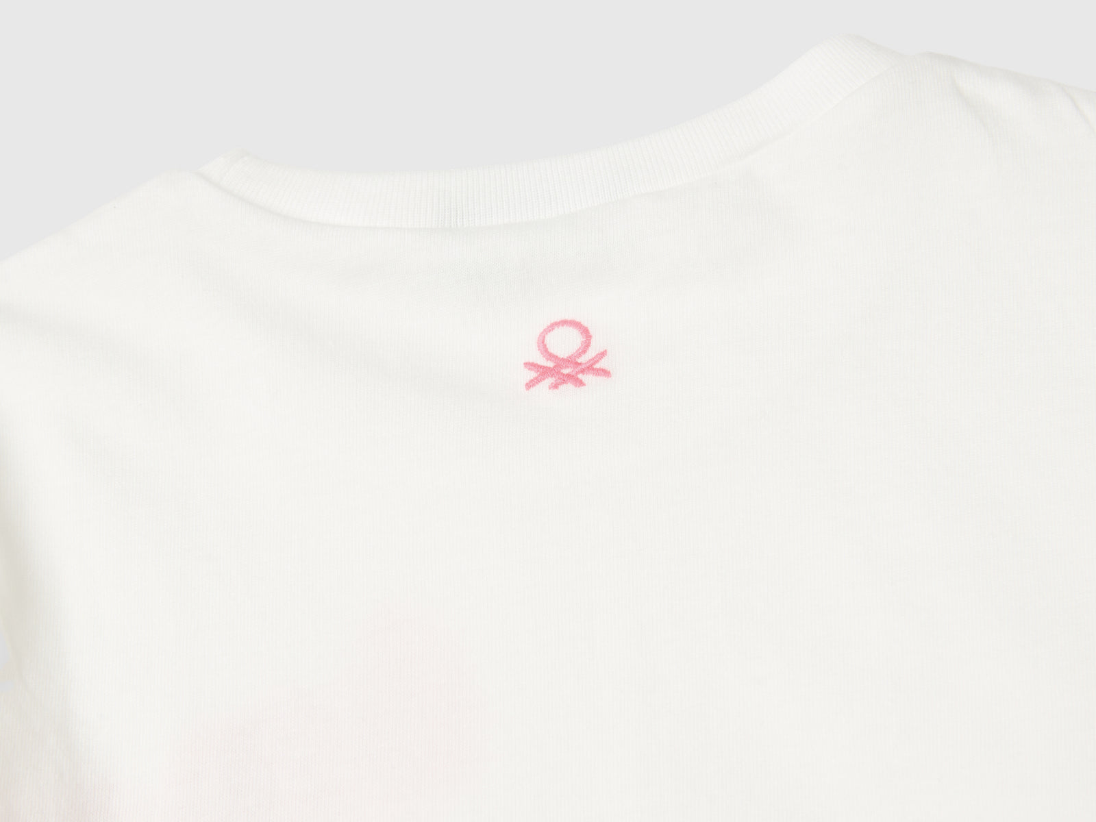 T-shirt in cotone bio con stampa glitter da bimba bianco panna 3 | Benetton Outlet