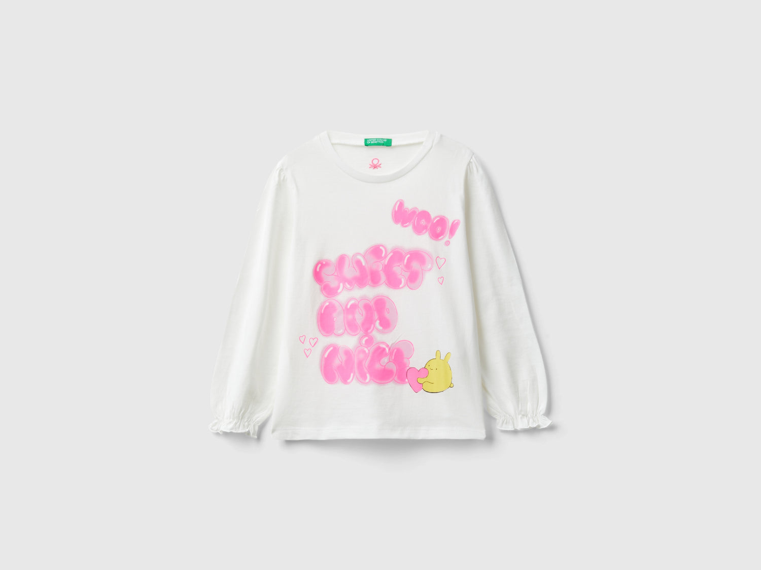 T-shirt in cotone bio con stampa glitter da bimba bianco panna | Benetton Outlet