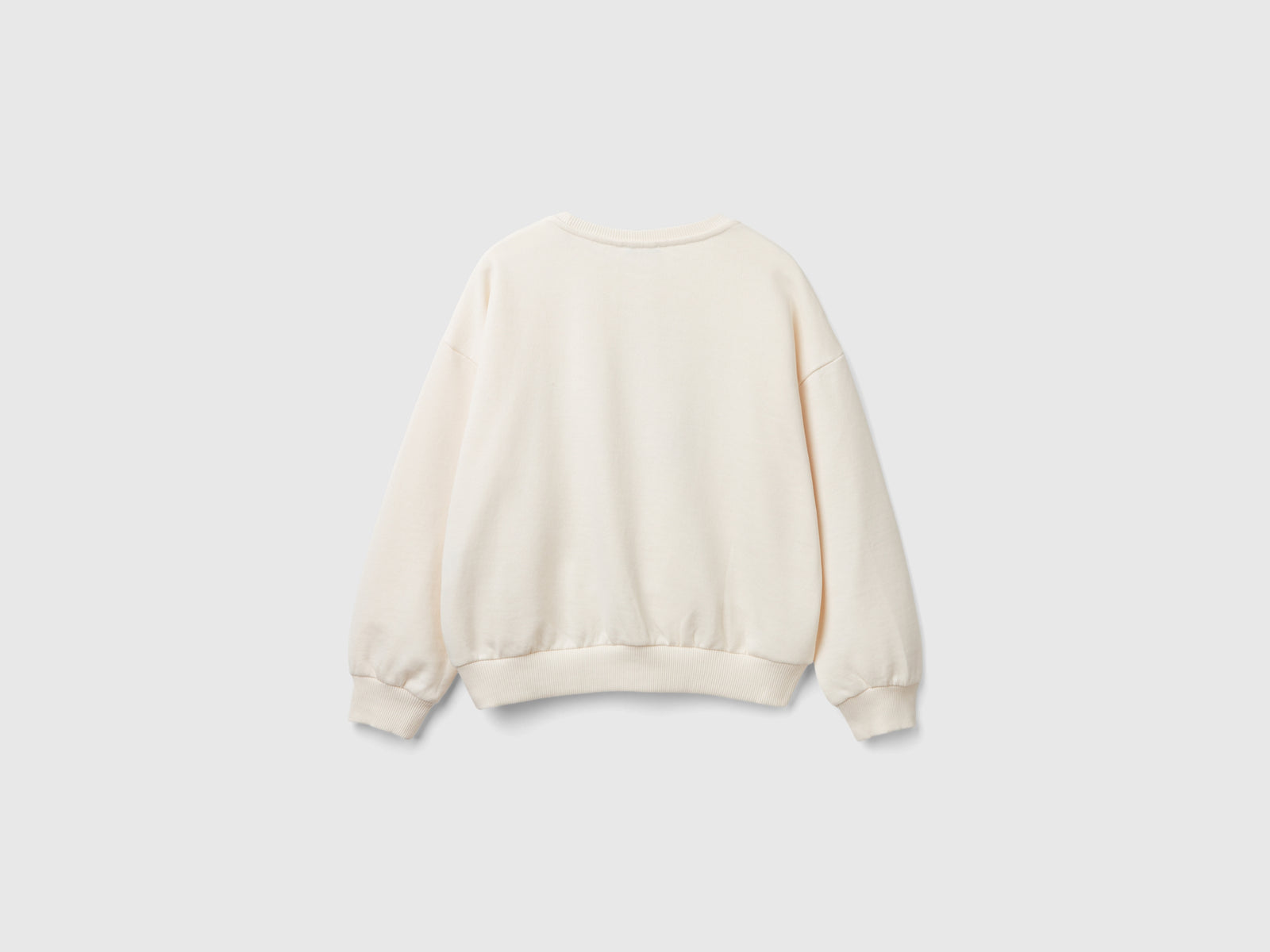 Felpa con paillettes da bambina bianco panna 2 | Benetton Outlet