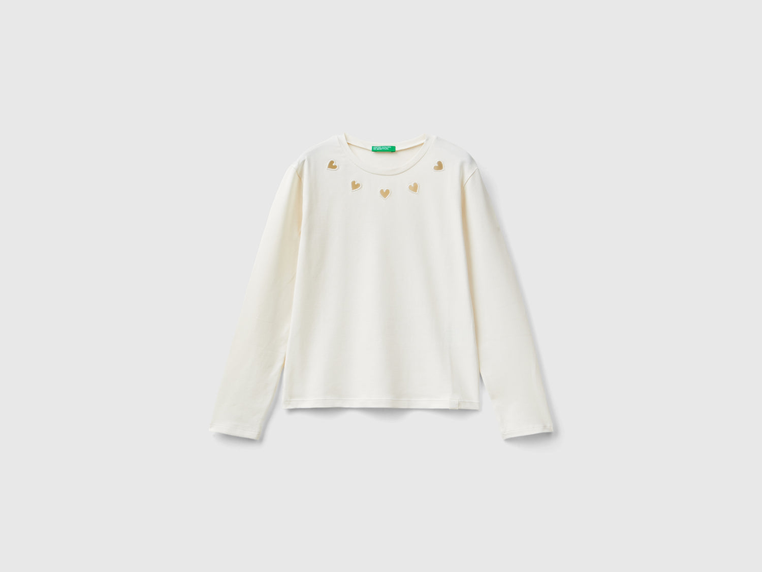 T-shirt con cuori cut out da bambina bianco panna | Benetton Outlet