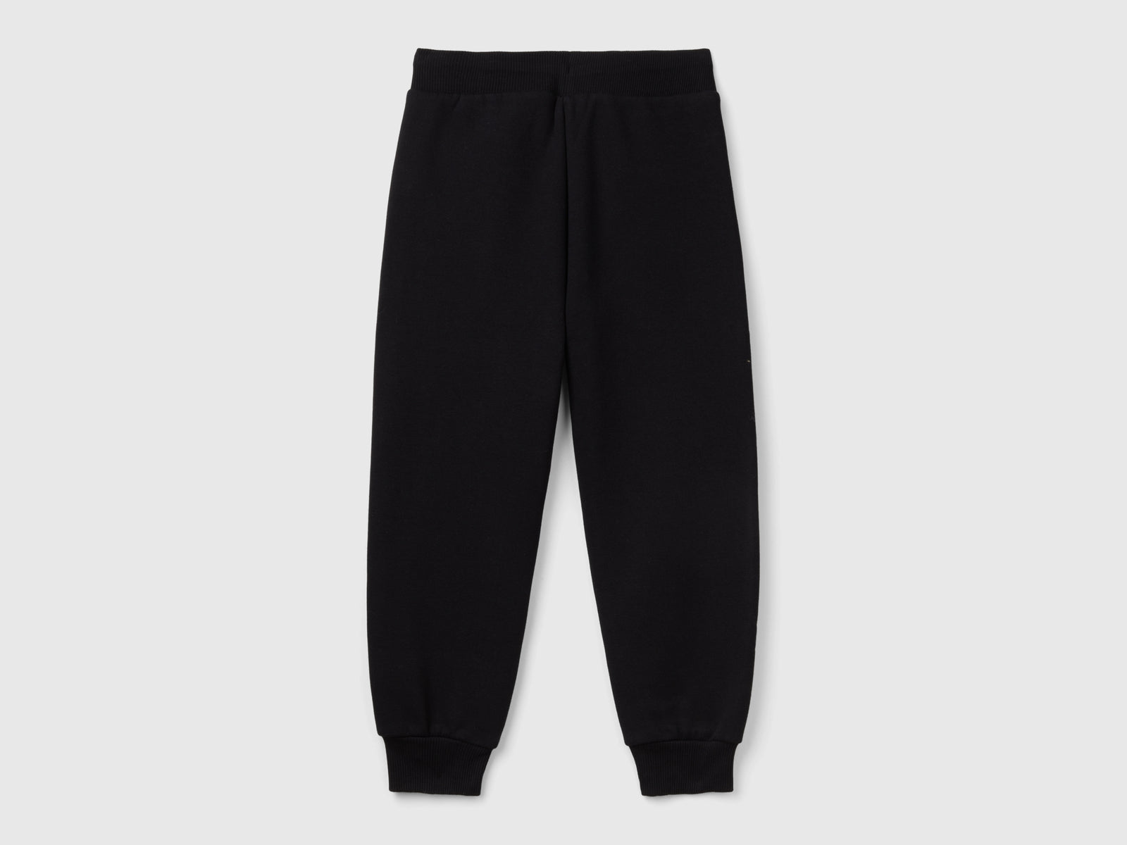 Pantaloni in calda felpa con stampa da bambino nero 2 | Benetton Outlet