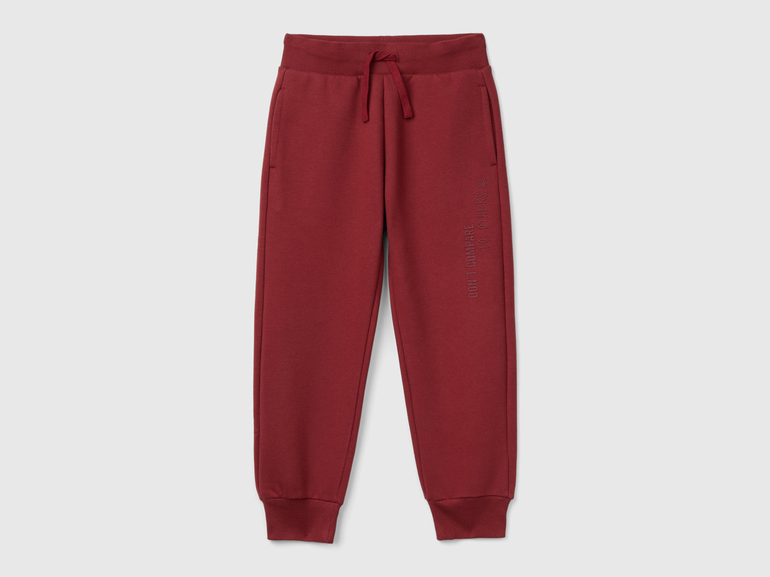 Pantaloni in calda felpa con stampa da bambino bordeaux | Benetton Outlet