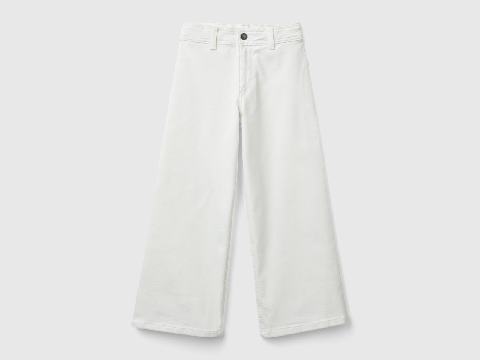 Pantaloni ampi in cotone stretch da bambina bianco panna | Benetton Outlet
