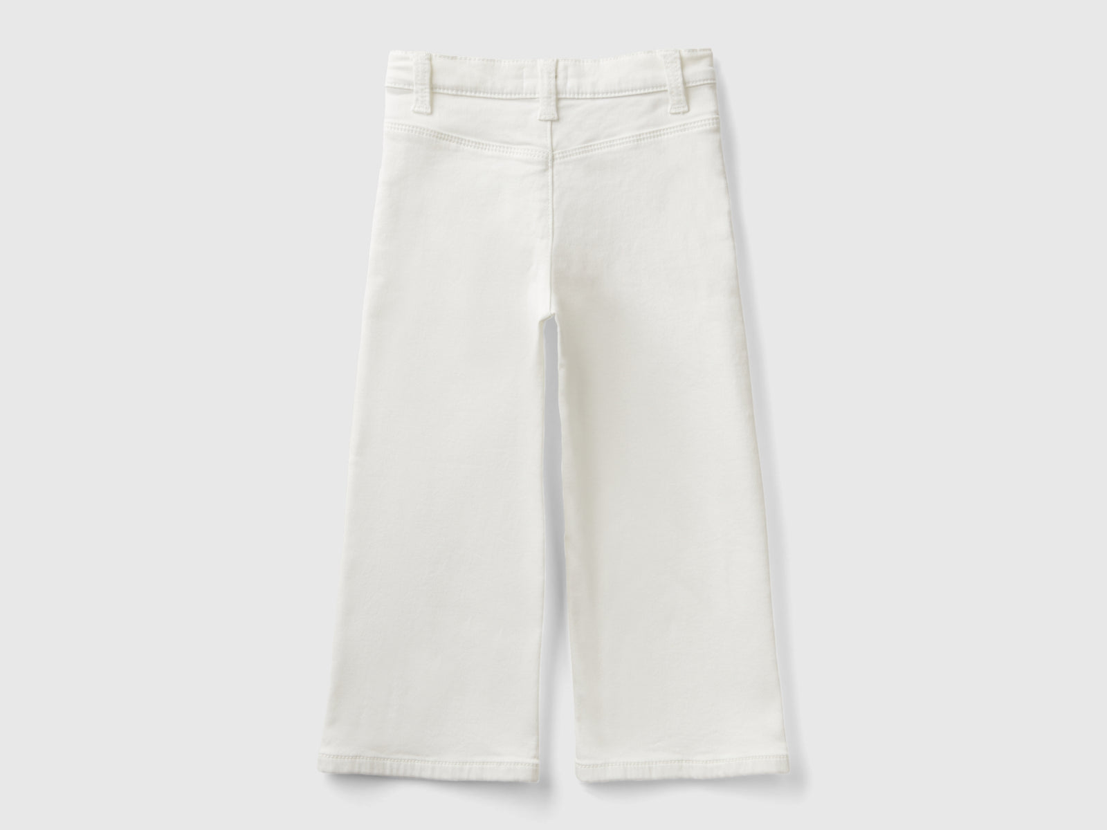 Pantaloni ampi in cotone stretch da bimba bianco panna 2 | Benetton Outlet