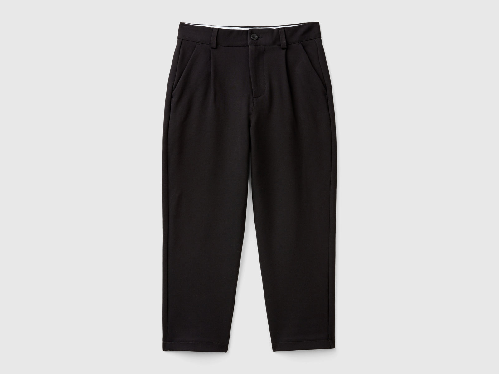 Pantaloni in misto viscosa stretch da bambino nero | Benetton Outlet