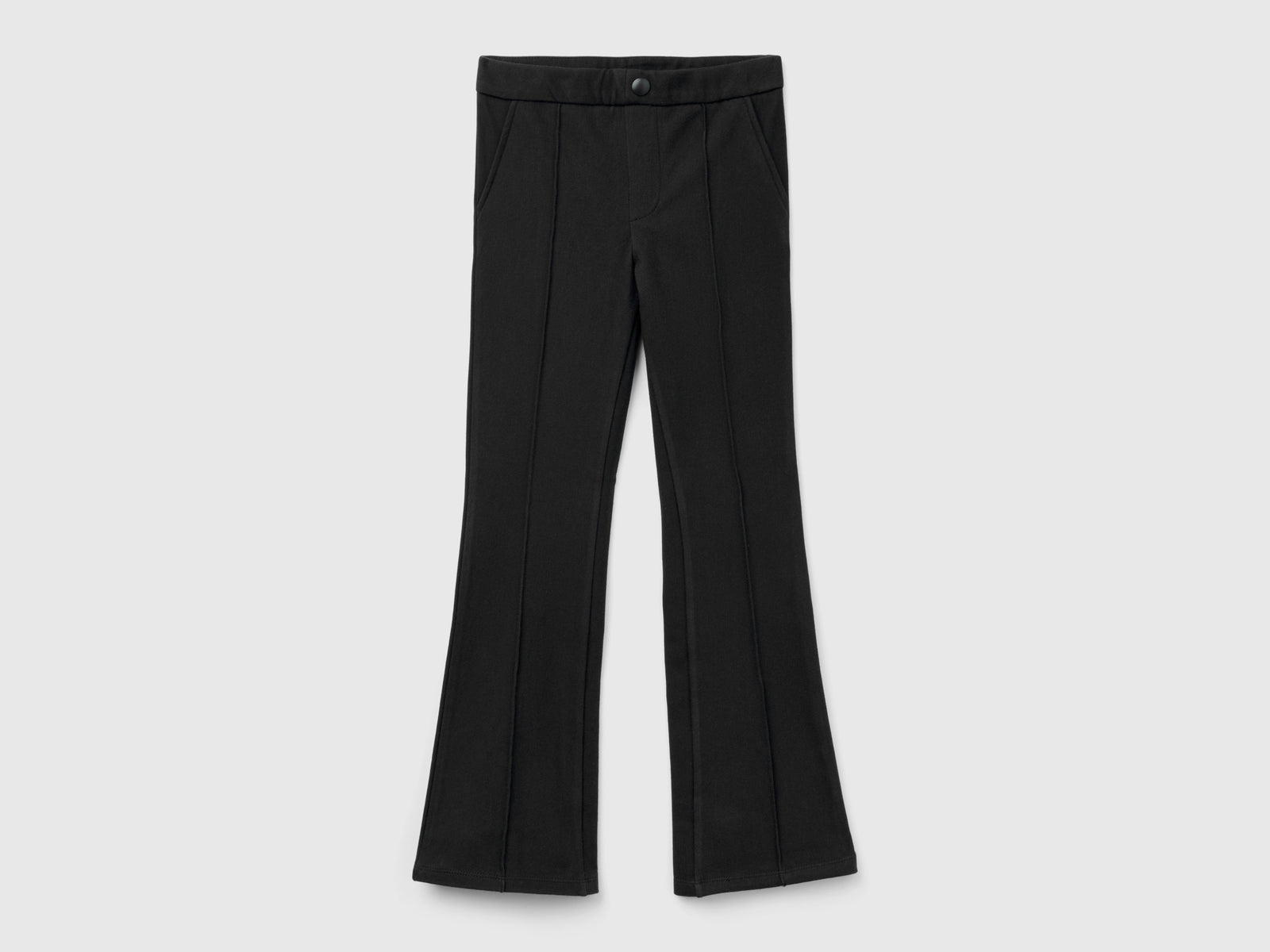 Pantaloni a zampa super stretch da bambina nero | Benetton Outlet