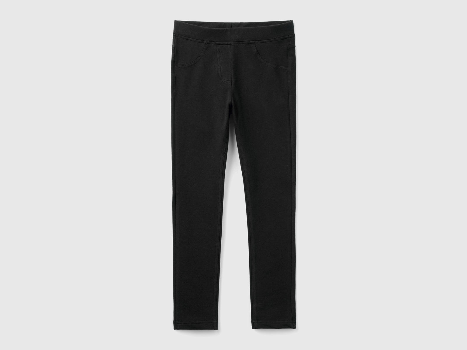 Jeggings de polar elástico da bambina nero | Benetton Outlet