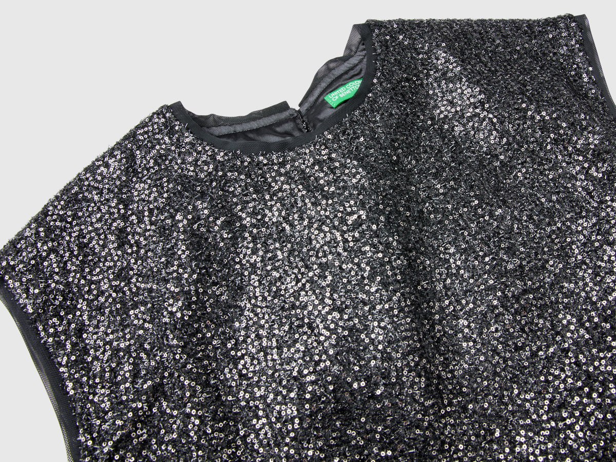 Top boxy fit con paillettes
