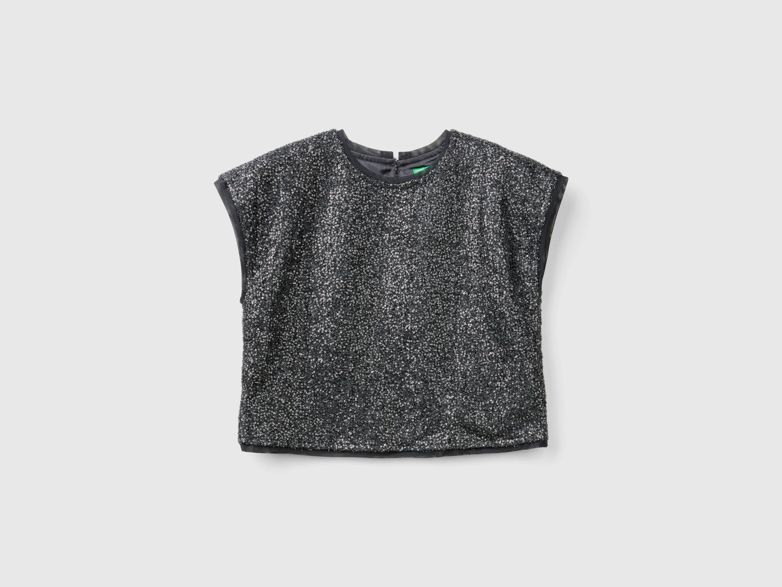 Top boxy fit con paillettes da bambina nero | Benetton Outlet