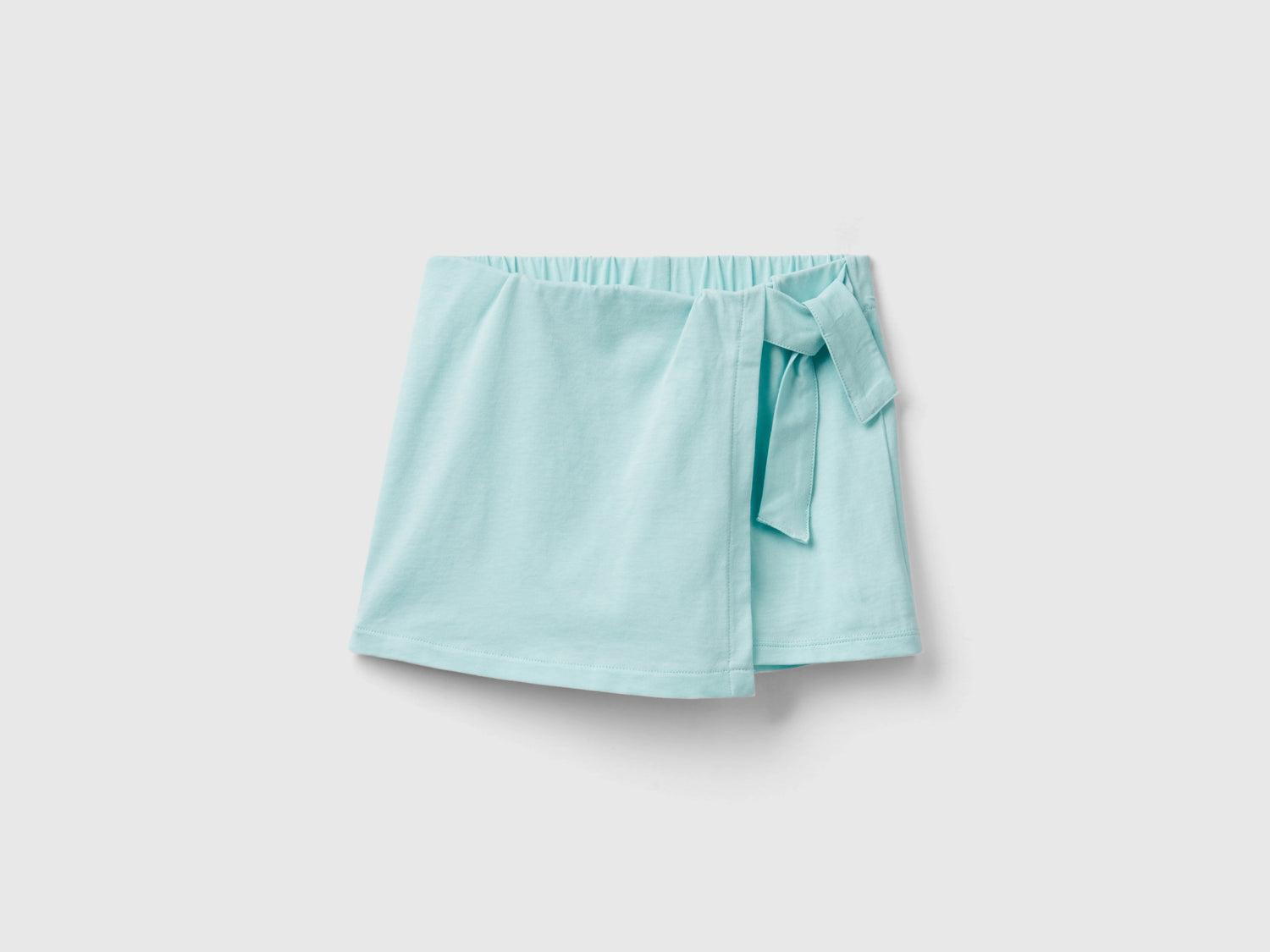 Shorts with panel da bambina verde acqua | Benetton Outlet