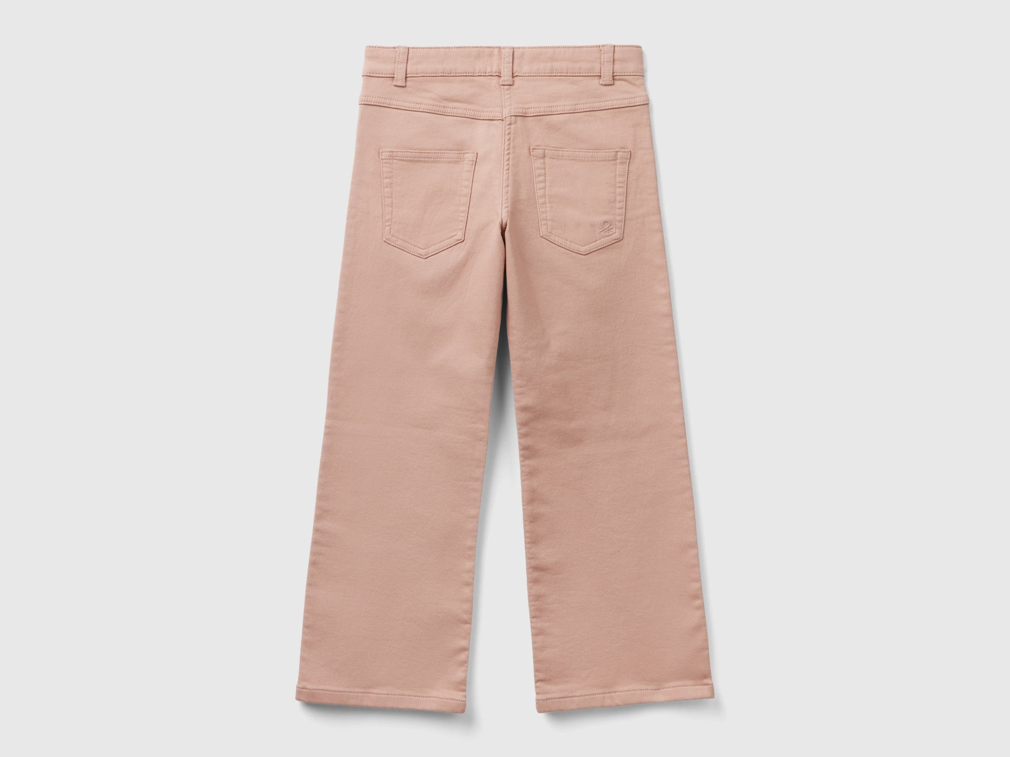 Pantaloni a zampa stretch da bambina rosa tenue Benetton Outlet
