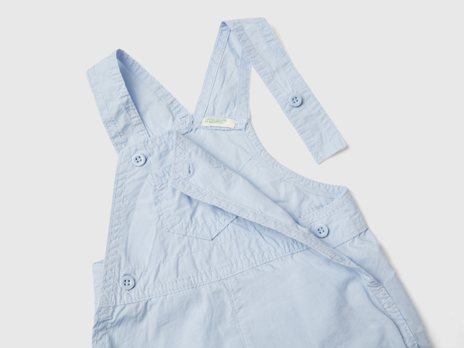 Pagliaccetto salopette in 100% cotone da neonato celeste 3 | Benetton Outlet
