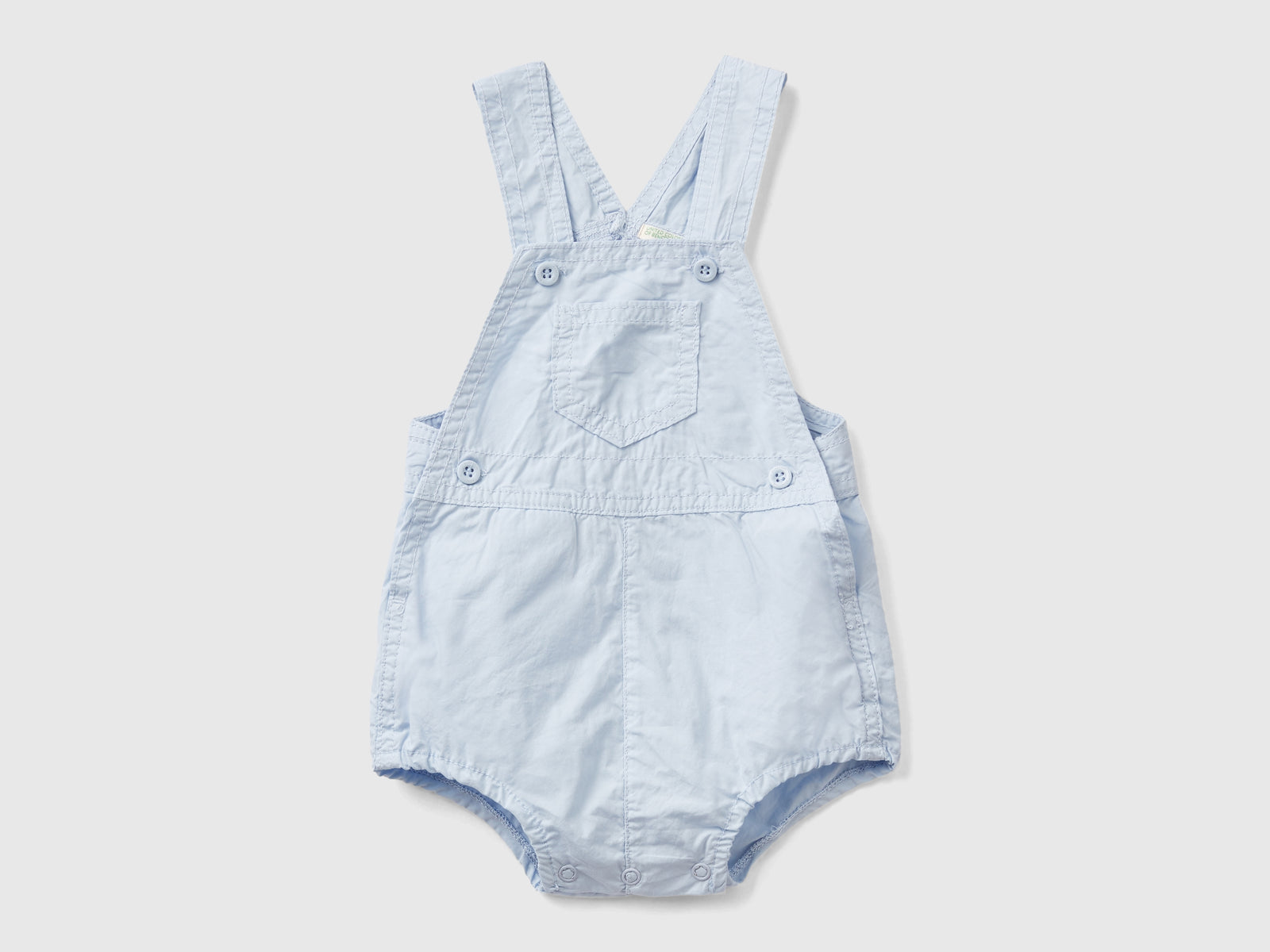Pagliaccetto salopette in 100% cotone da neonato celeste | Benetton Outlet