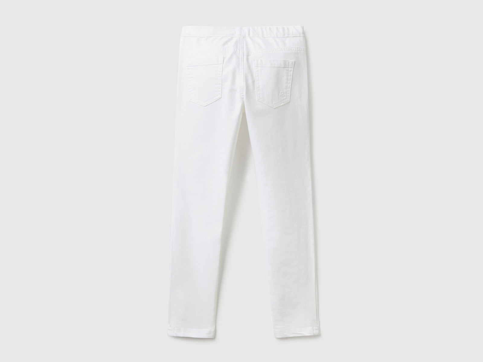 Pantaloni super skinny da bambina bianco 2 | Benetton Outlet