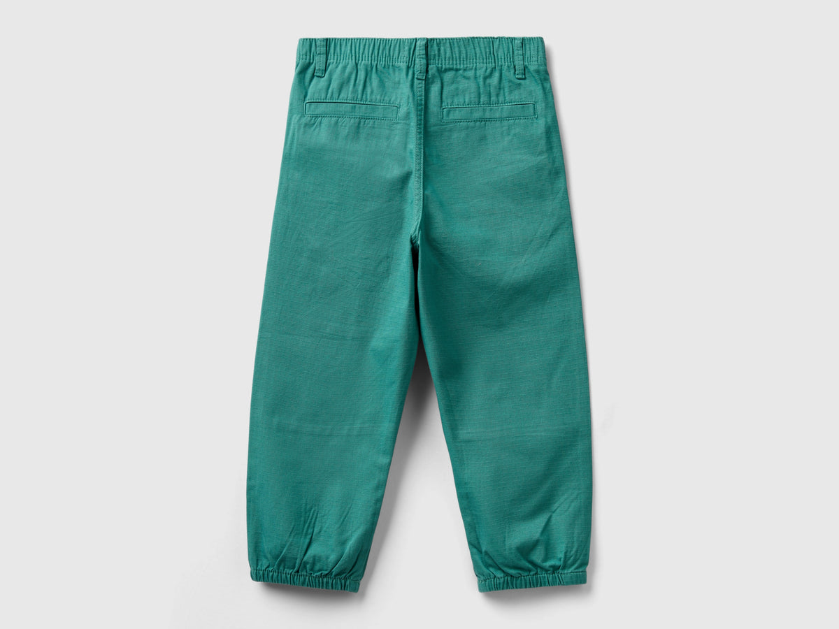Pantaloni con tagli 100% cotone
