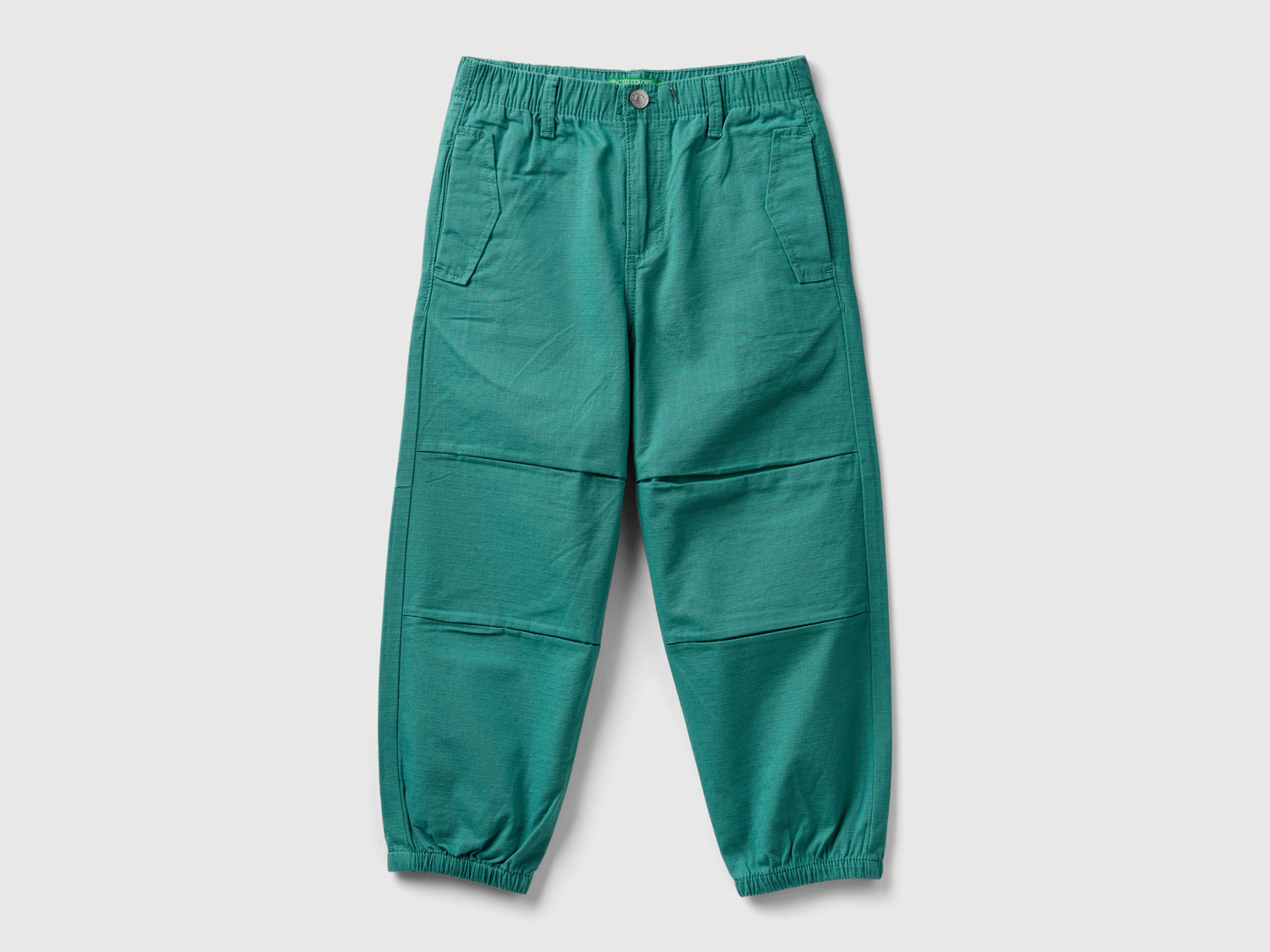 Pantaloni con tagli 100% cotone da bambino verde | Benetton Outlet
