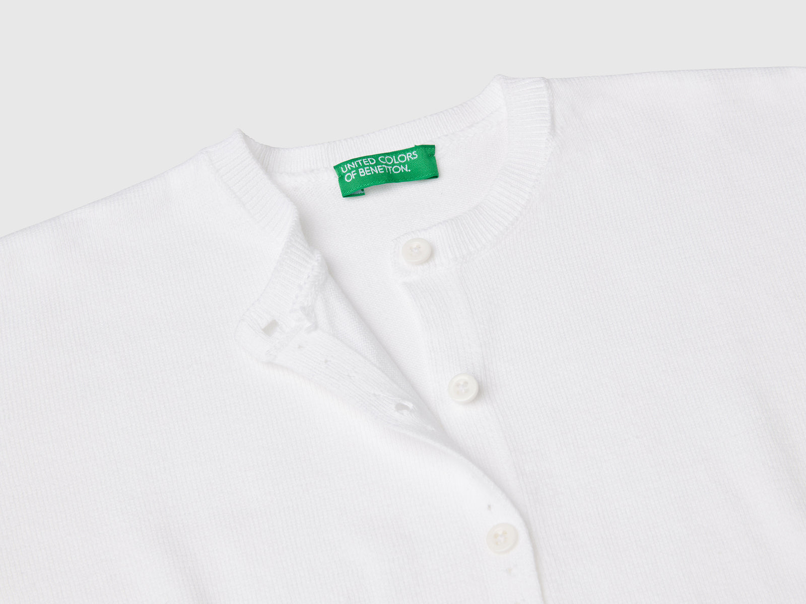 Cardigan girocollo in puro cotone da bimba bianco 3 | Benetton Outlet