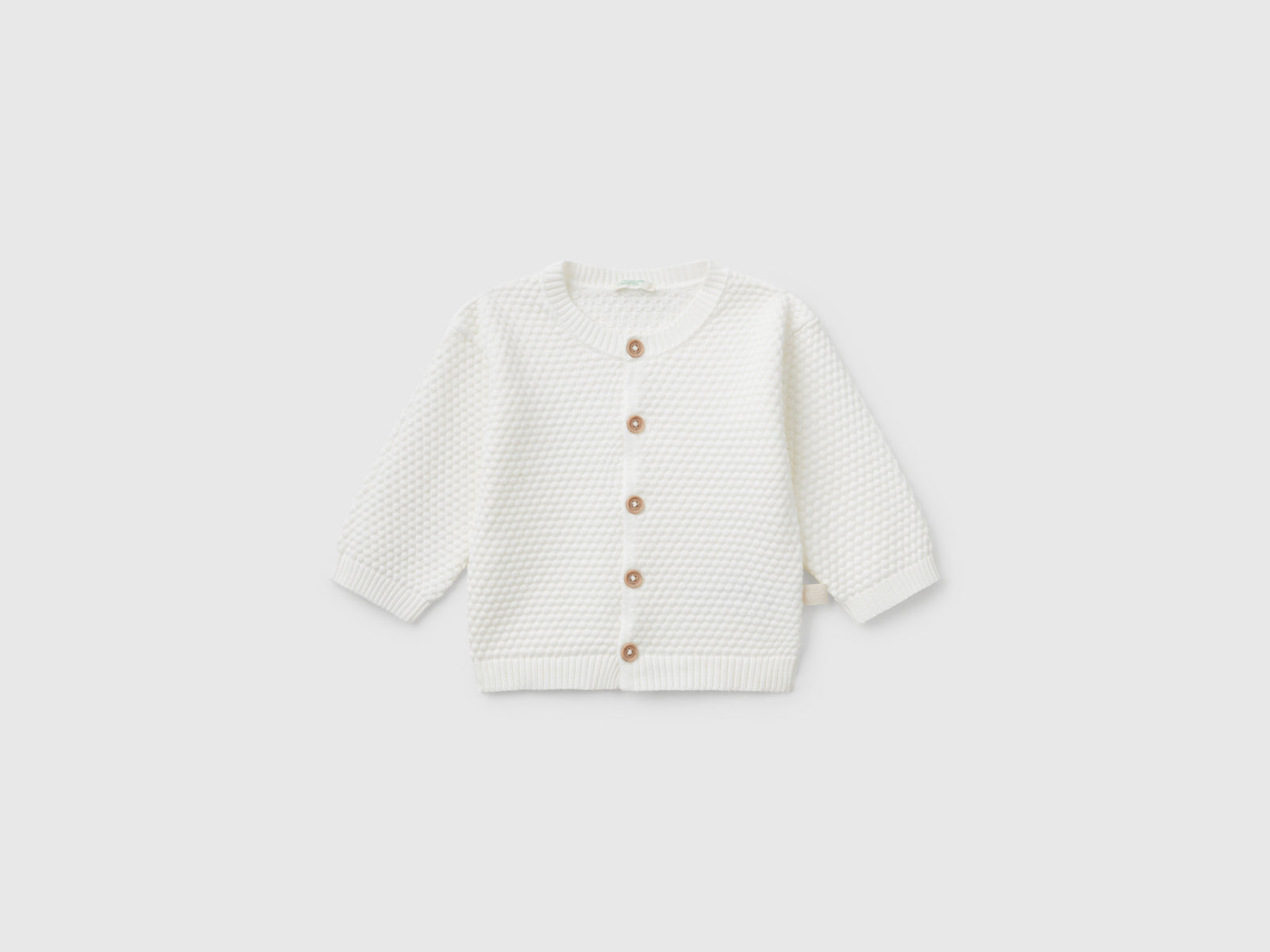 Cardigan lavorato 100% cotone da neonato bianco panna | Benetton Outlet