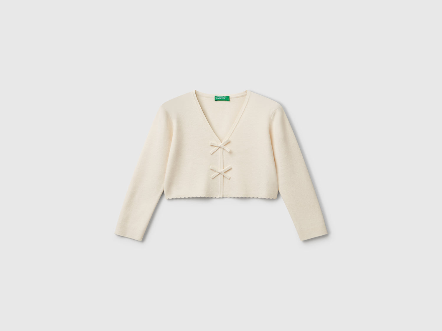 Cardigan con fiocchetti da bimba bianco panna | Benetton Outlet