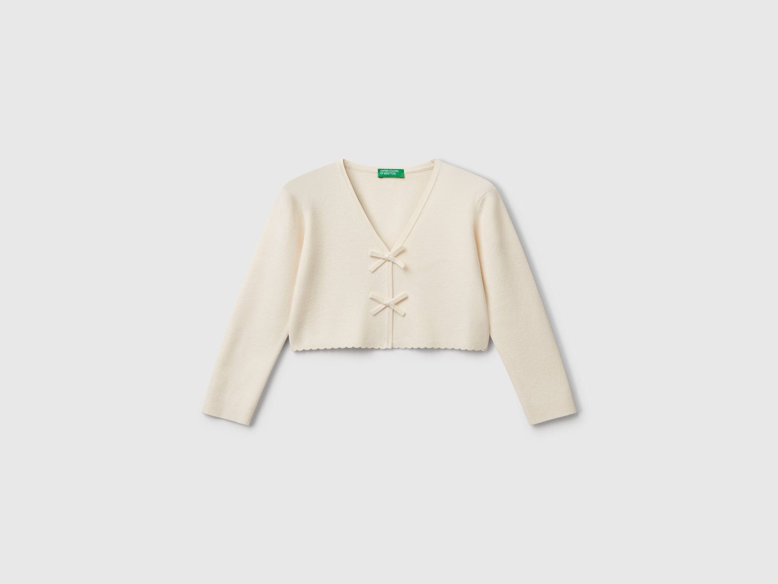 Cardigan con fiocchetti da bimba bianco panna | Benetton Outlet