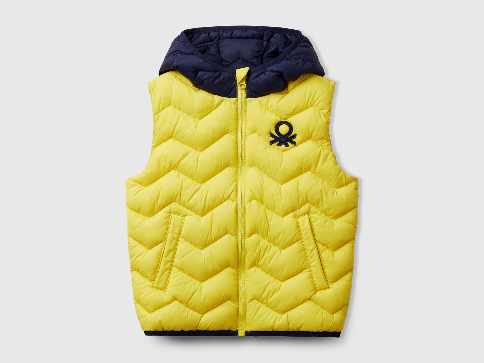 Gilet imbottito con cappuccio da bimbo giallo | Benetton Outlet