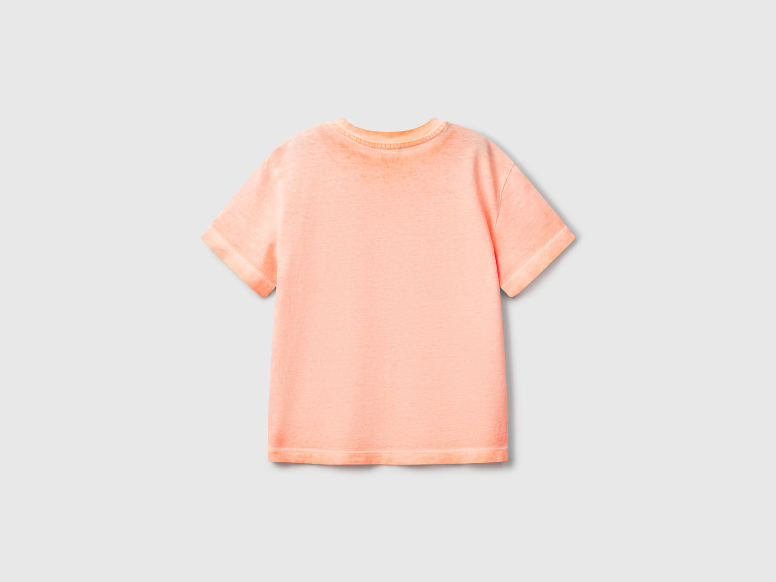 Maglietta over fit con ricamo da bimbo arancione fluo 2 | Benetton Outlet