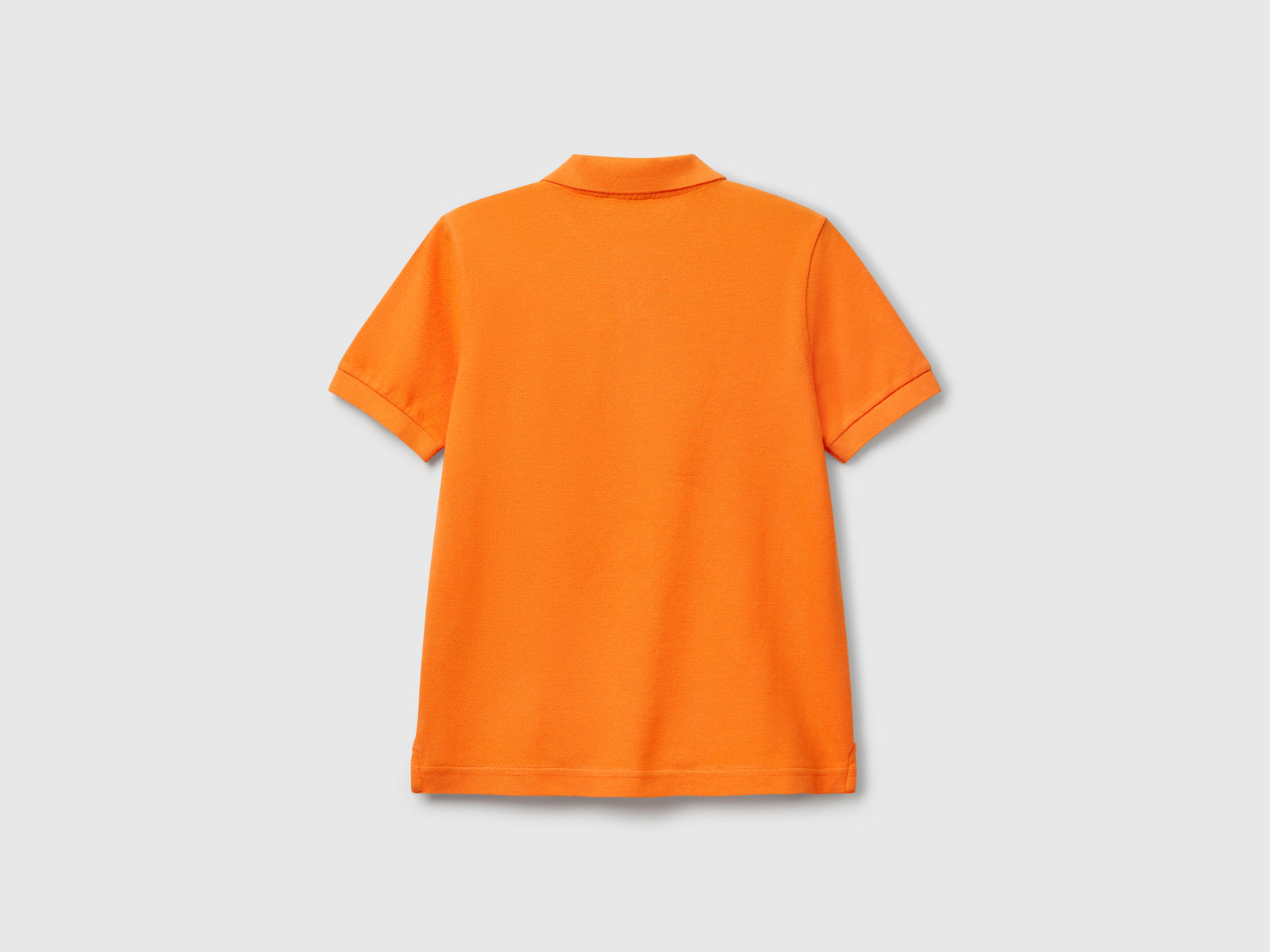 Polo slim fit in puro cotone da bambino arancione 2 | Benetton Outlet