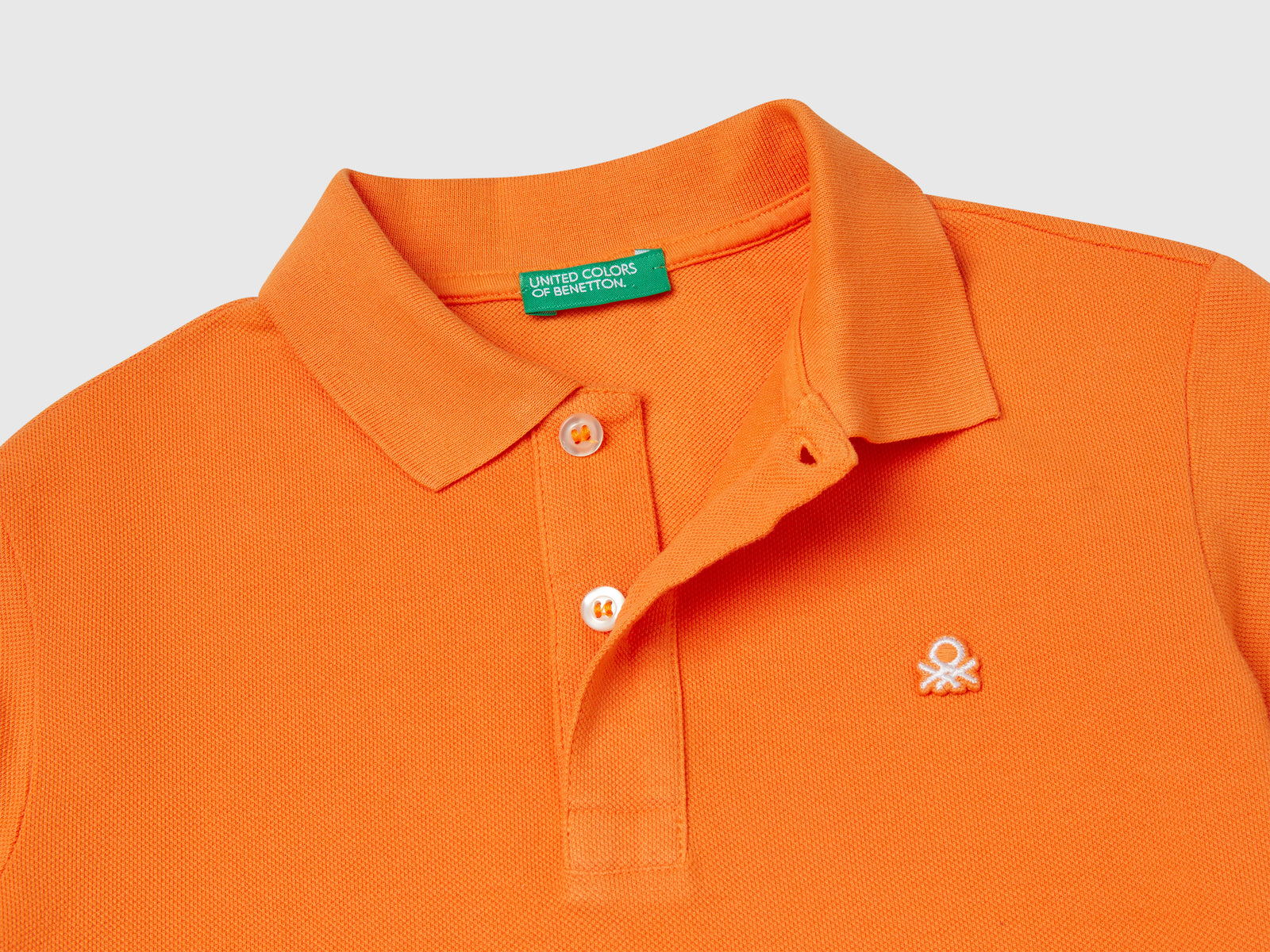 Polo slim fit in puro cotone da bambino arancione 3 | Benetton Outlet