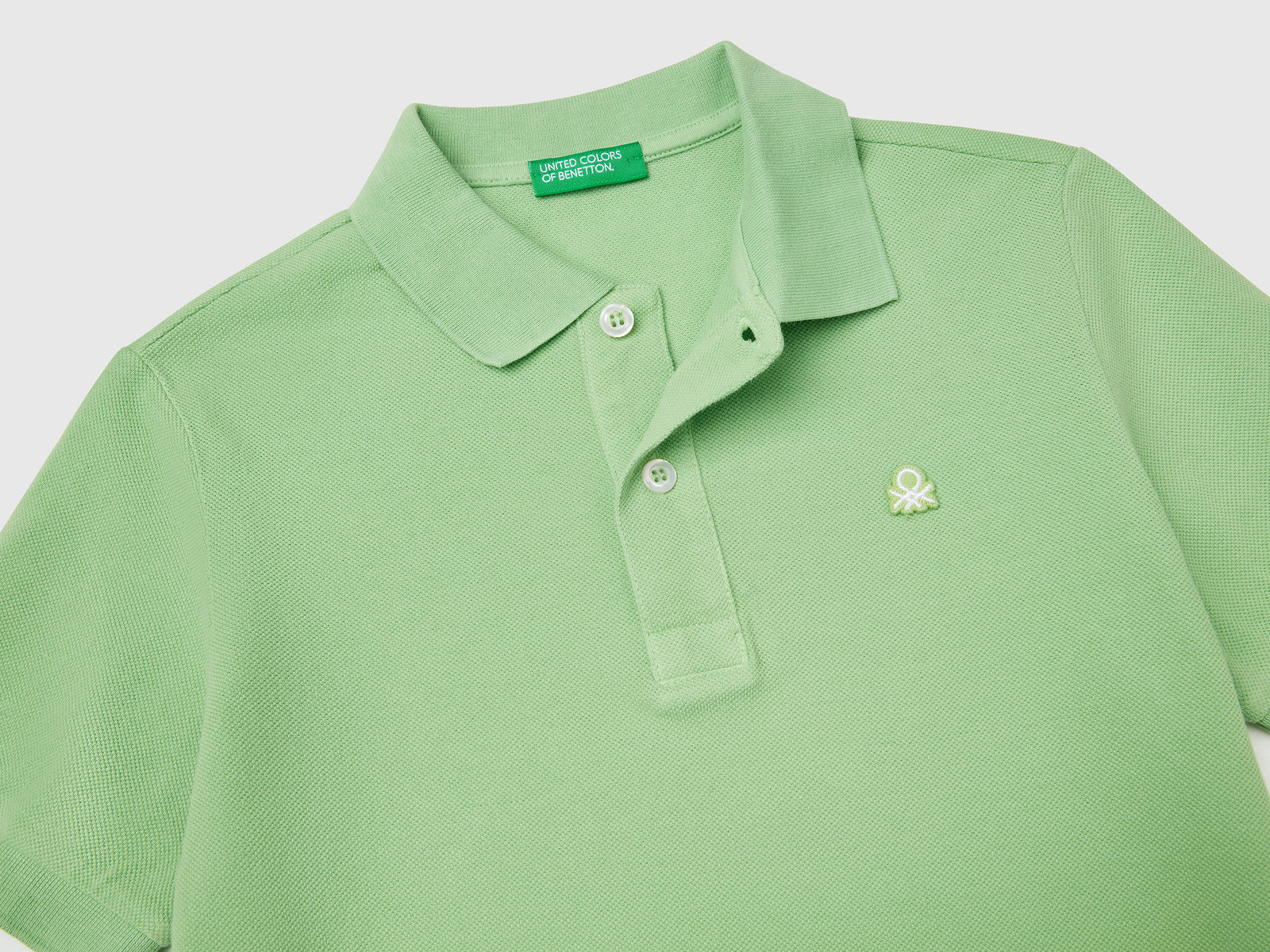 Polo slim fit in puro cotone da bambino verde 3 | Benetton Outlet