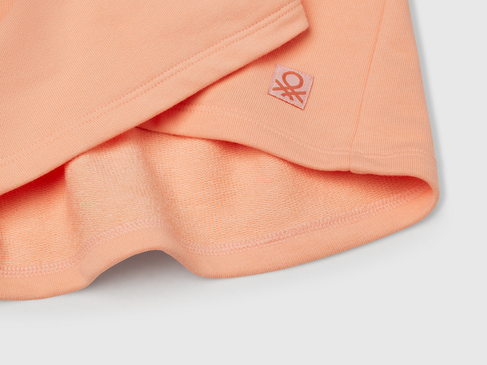 Gonna in felpa con pieghe da bambina pesca 3 | Benetton Outlet