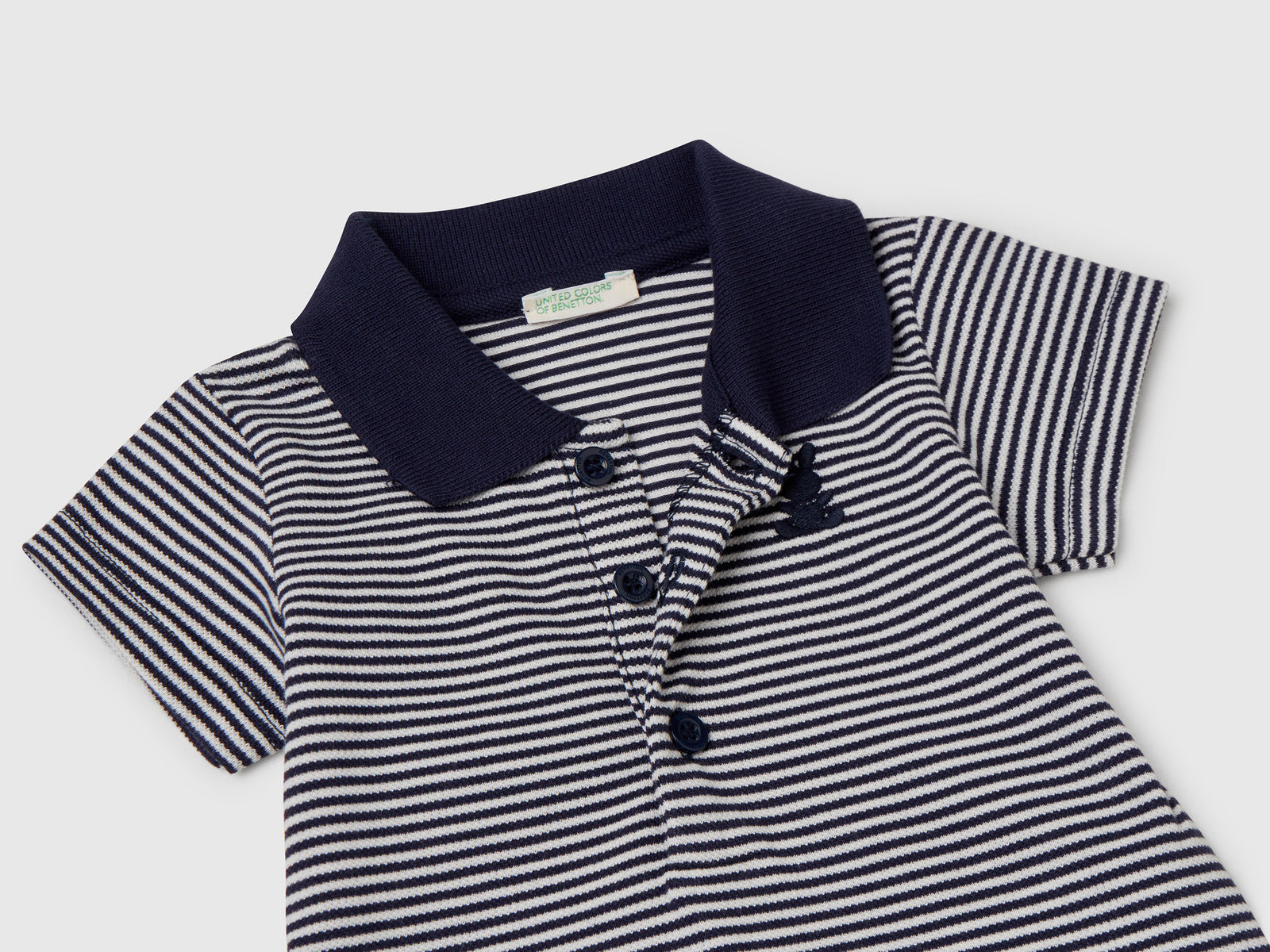 Body a polo in cotone elasticizzato da neonato blu scuro 3 | Benetton Outlet