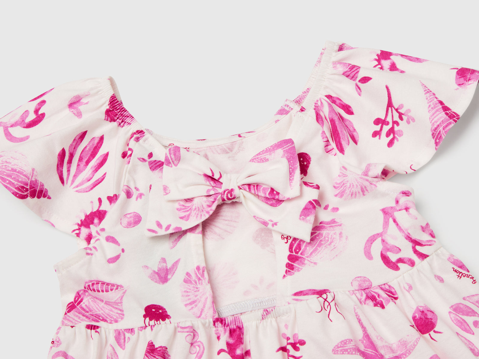 Vestito bianco con conchiglie da bimba rosa 3 | Benetton Outlet