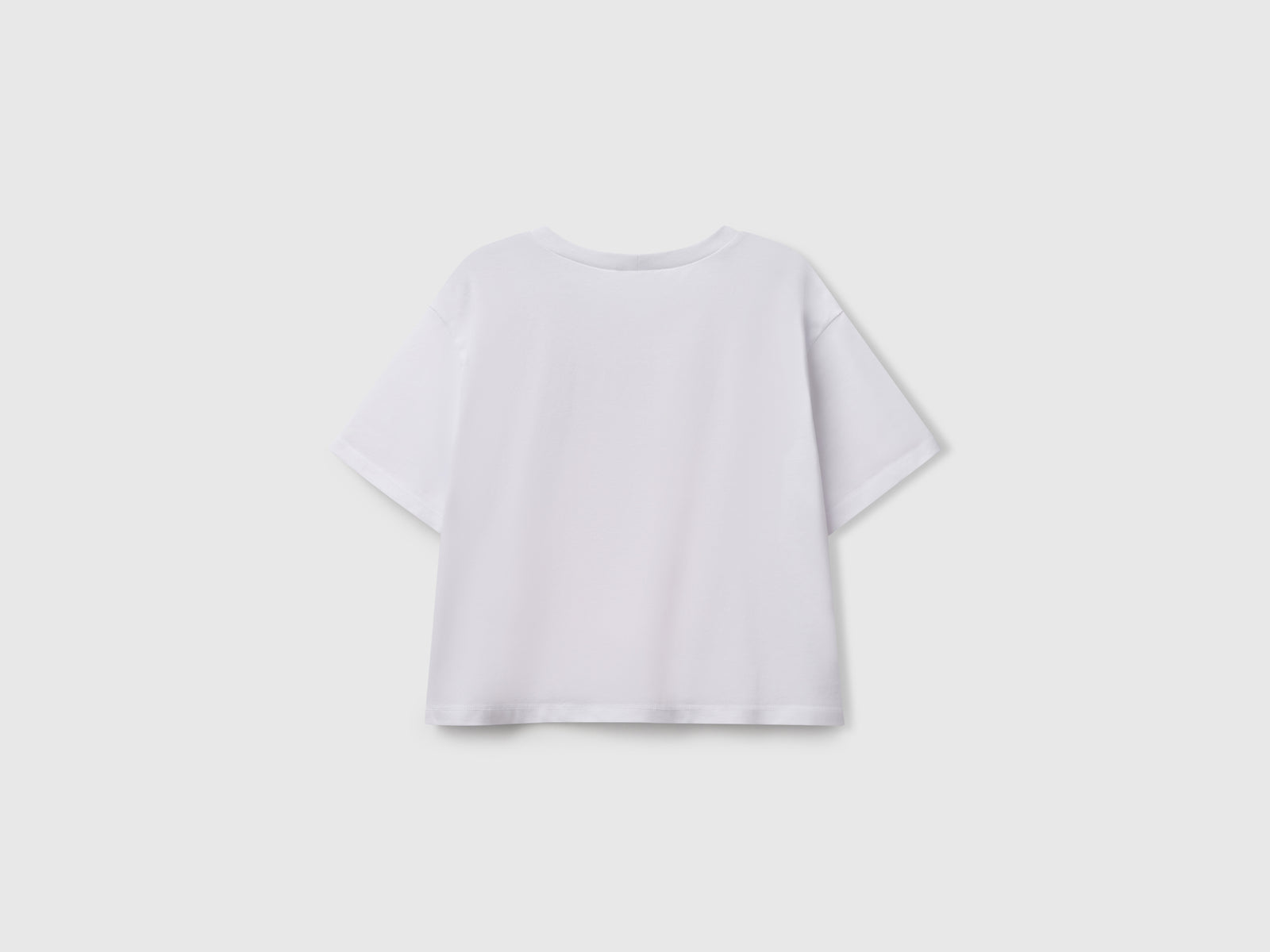 Maglietta con stampa glitterata da bambina bianco 2 | Benetton Outlet