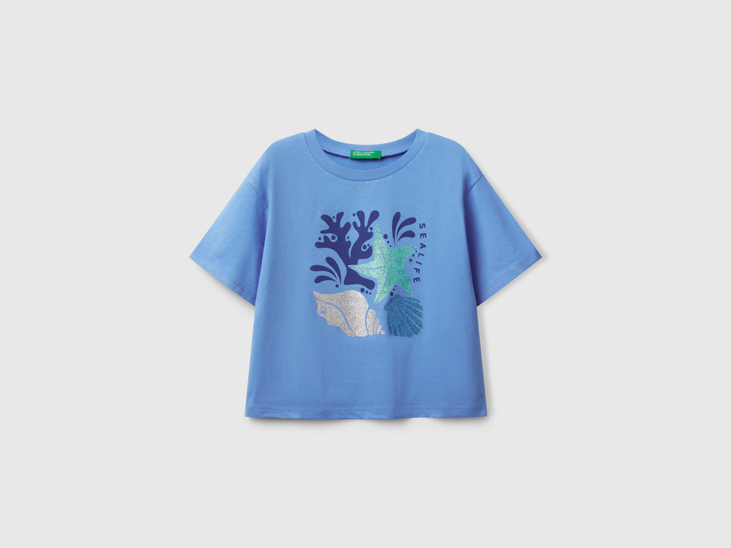 Maglietta con stampa glitterata da bambina celeste | Benetton Outlet