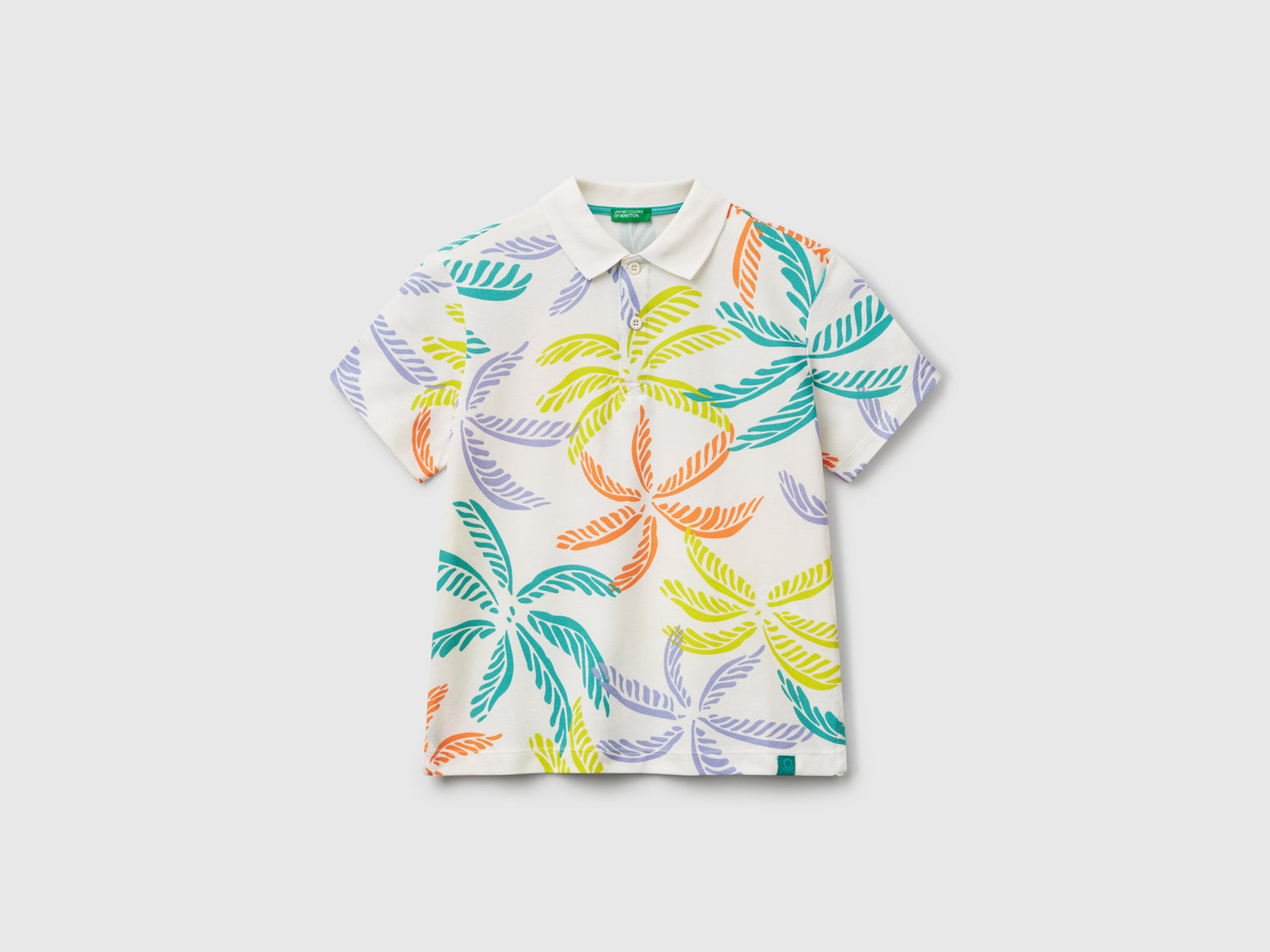 Polo con stampa tropicale da bambino bianco | Benetton Outlet