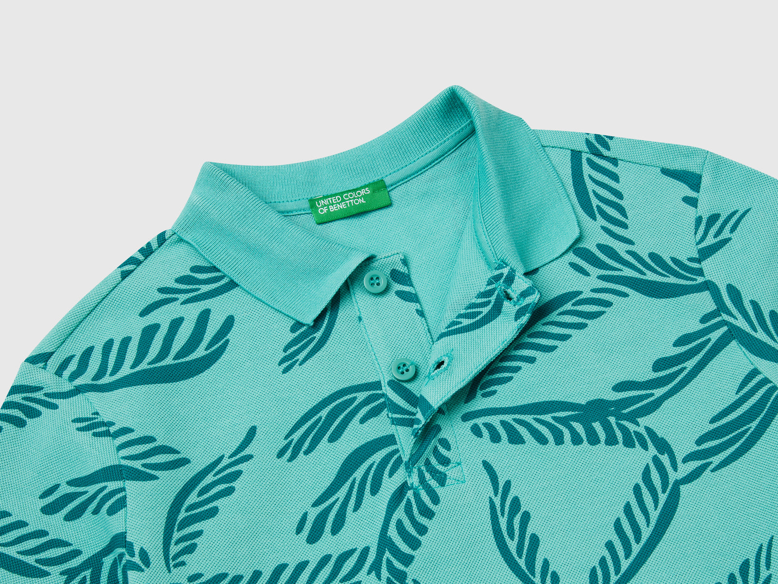 Polo con stampa tropicale da bambino verde 3 | Benetton Outlet