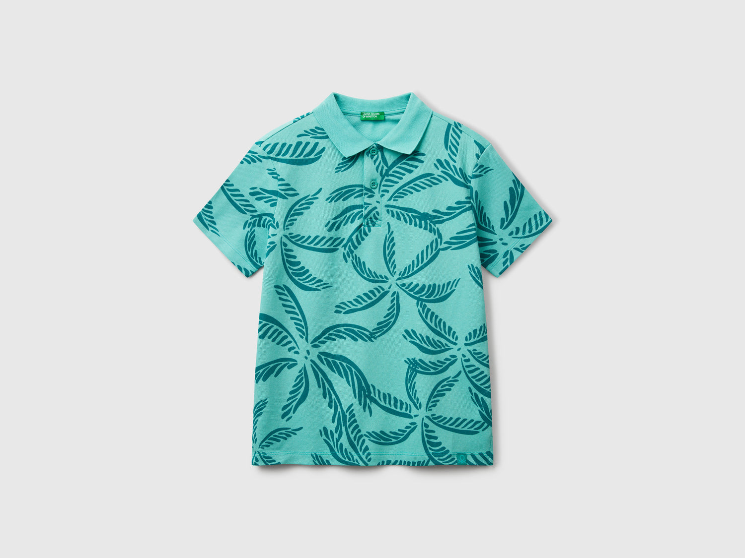 Polo con stampa tropicale da bambino verde | Benetton Outlet