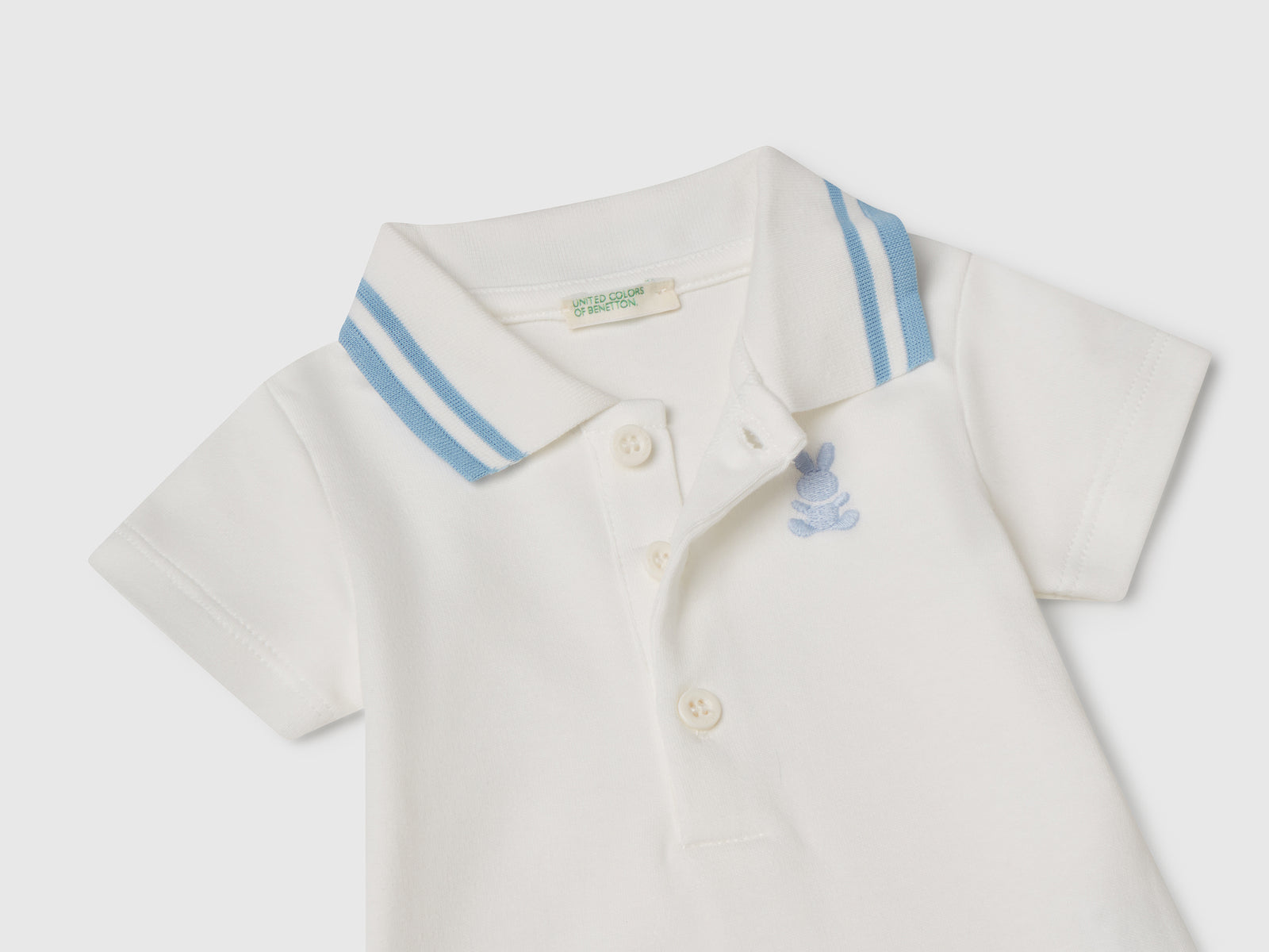 Body a polo in cotone da neonato bianco panna 3 | Benetton Outlet